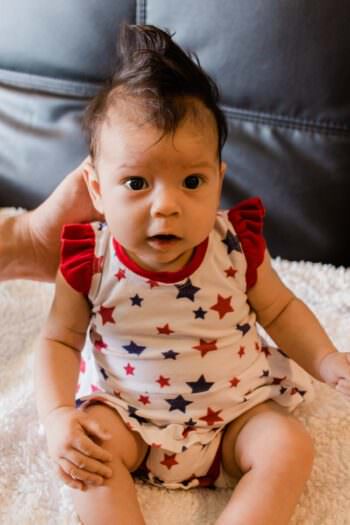 Baby in a star spangled outfit