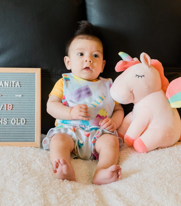 3 month old in popsicle overalls and mustard shirt