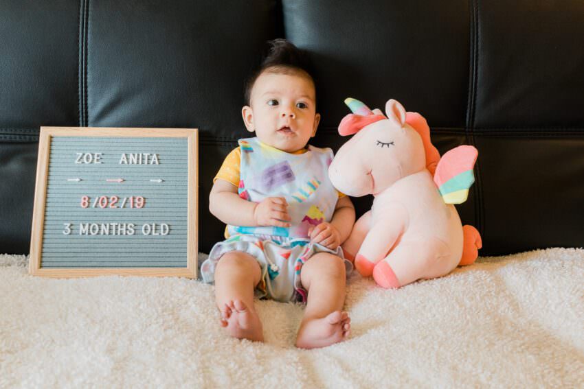 3 month old in popsicle overalls and mustard shirt